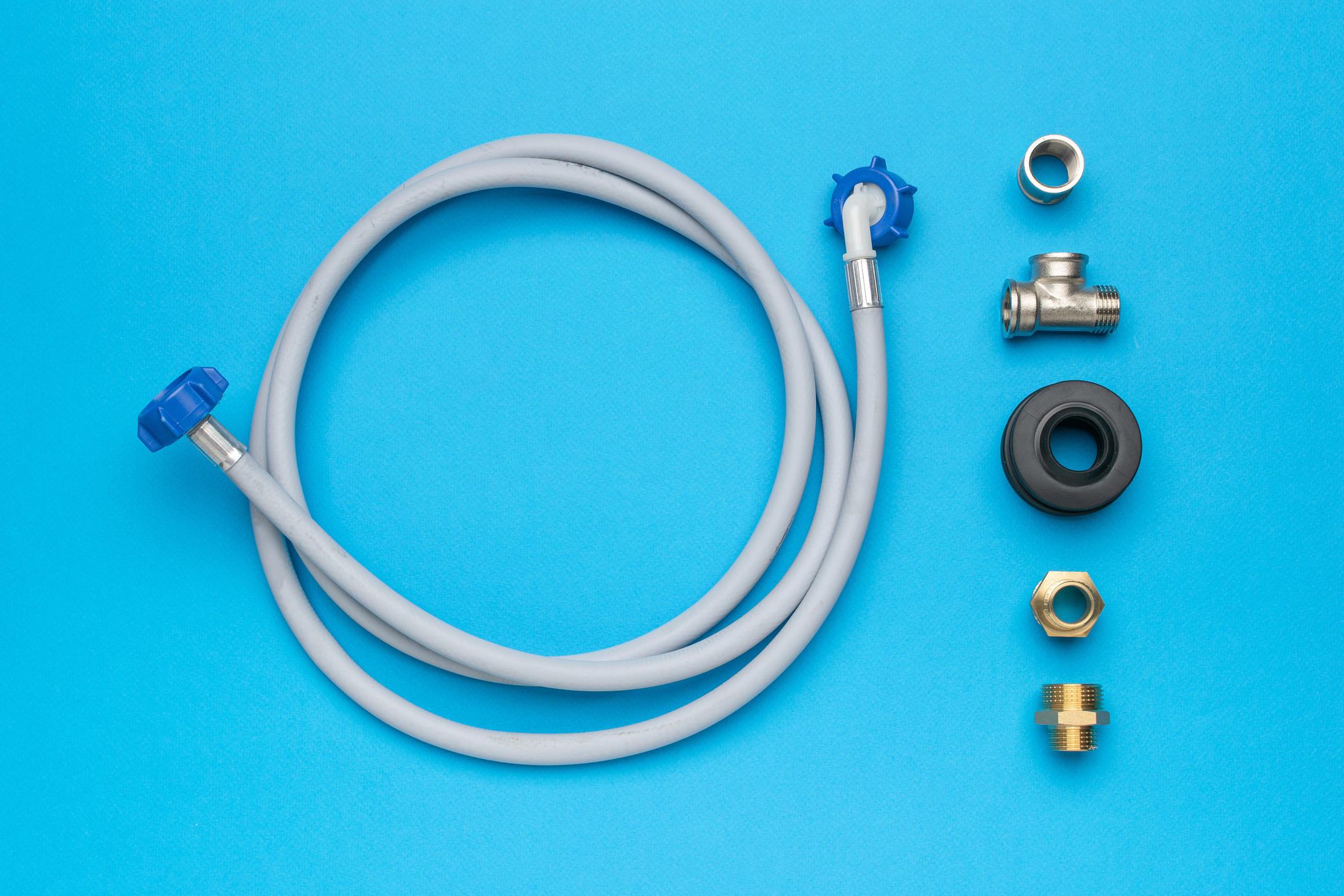 Various dishwasher parts against a blue background